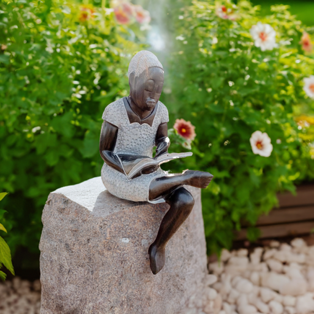 Book Reader - Stone Sculpture Made of Springstone by Jonathan Mondorahuma | Zimbabwe