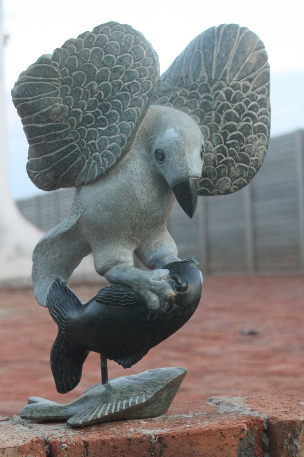 Fish Eagle - Stone Sculpture Made of Black Serpentine by Passmore Mashaya | Zimbabwe