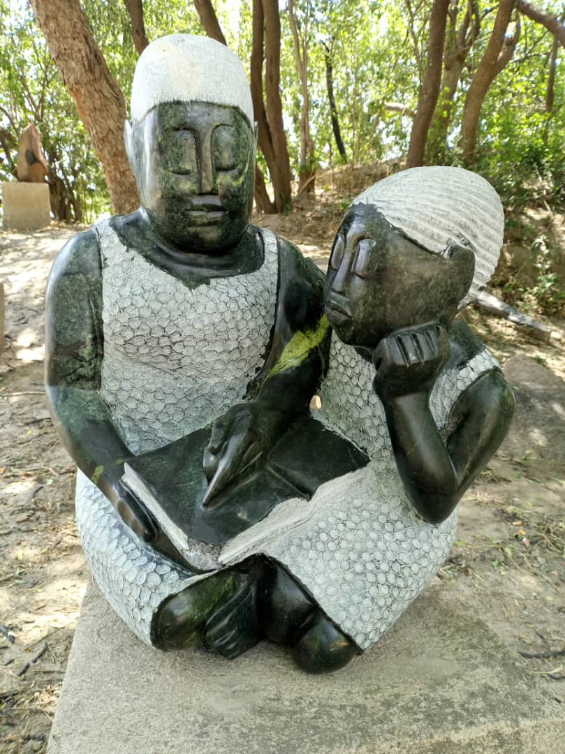 Teach Me to Read - Stone Sculpture Made of Leopard Rock By Jonathan Mondorohuma | Zimbabwe