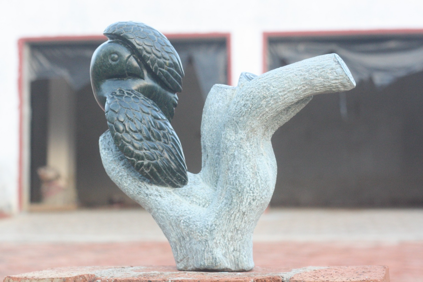 Preening Bird - Stone Sculpture Made of Springstone by Passmore Mashaya | Zimbabwe