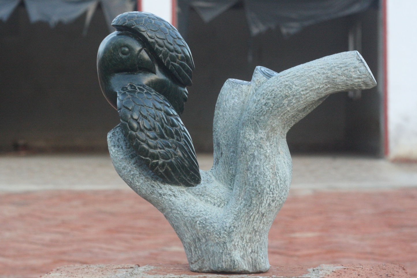 Preening Bird - Stone Sculpture Made of Springstone by Passmore Mashaya | Zimbabwe