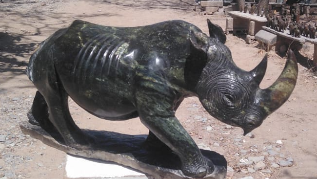 Rhino - Stone Sculpture Made of Leopard Rock by Rony Nyamhunga | Zimbabwe