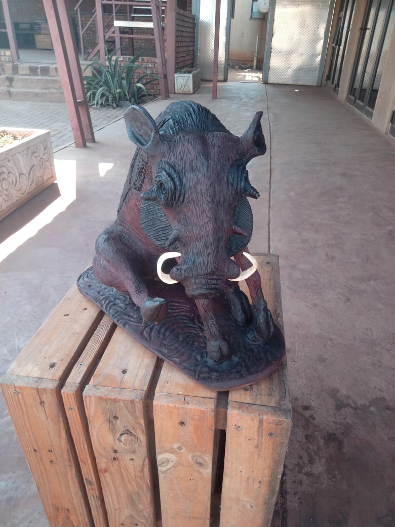 Warthog :  Carved from Ironwood by Killian Torovasei | Zimbabwe