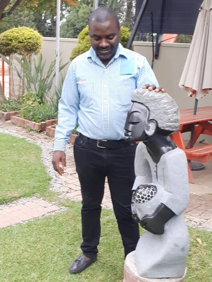 Nursing the Future - Stone Sculpture Made of Springstone by Cephas Mashaya | Zimbabwe