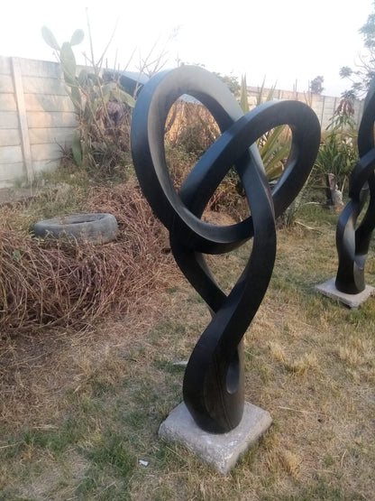 Locked Up - Stone Sculpture Made of Springstone by Blessng Mutukwa | Zimbabwe