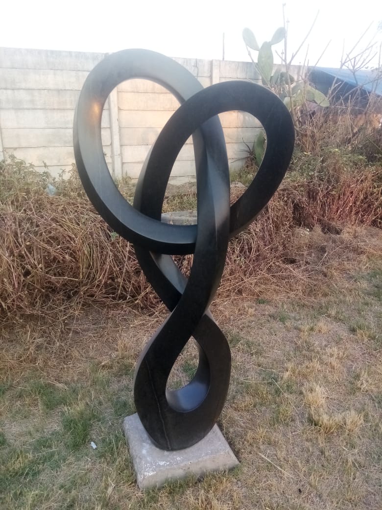 Locked Up - Stone Sculpture Made of Springstone by Blessng Mutukwa | Zimbabwe