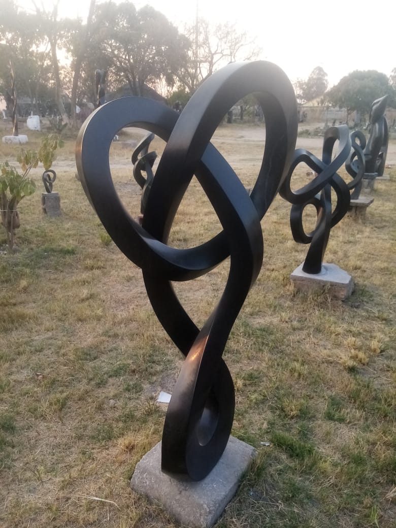 Locked Up - Stone Sculpture Made of Springstone by Blessng Mutukwa | Zimbabwe