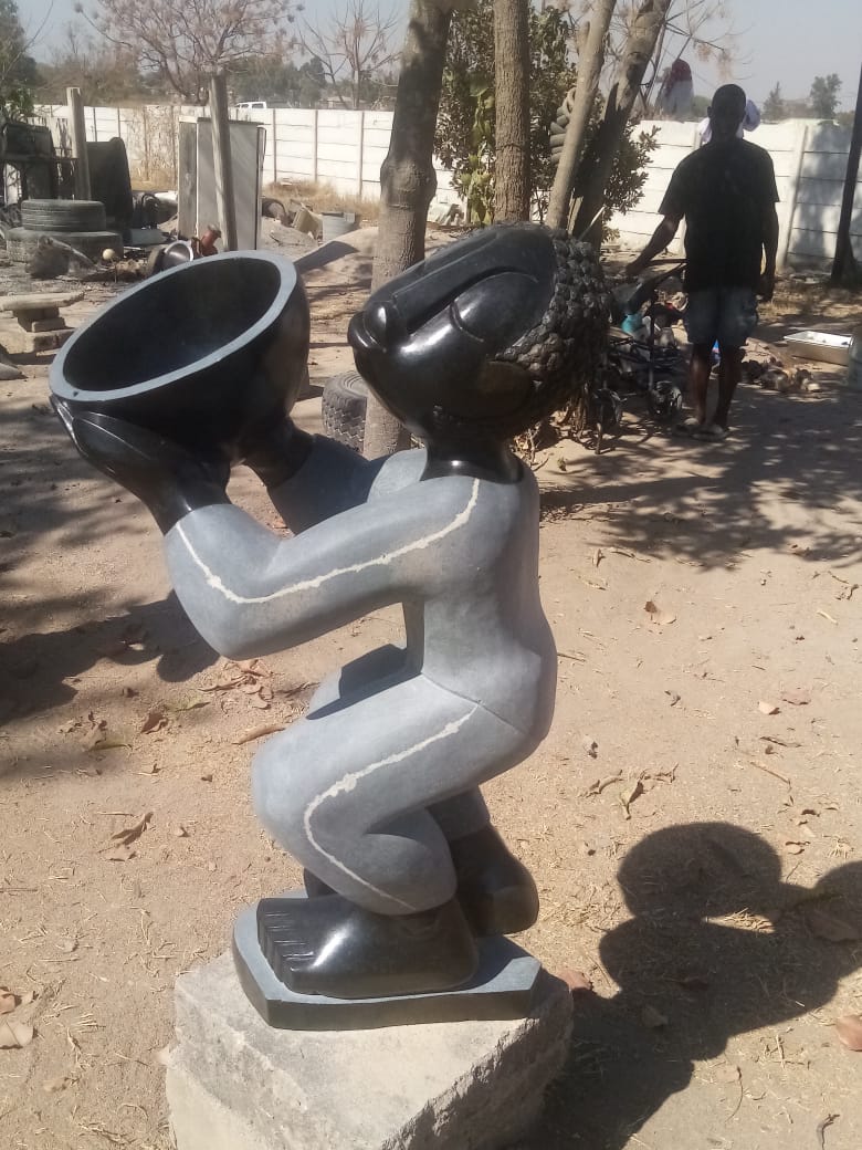 At Your Service - Stone Sculpture Made of Springstone by Jetro Zinyeka | Zimbabwe