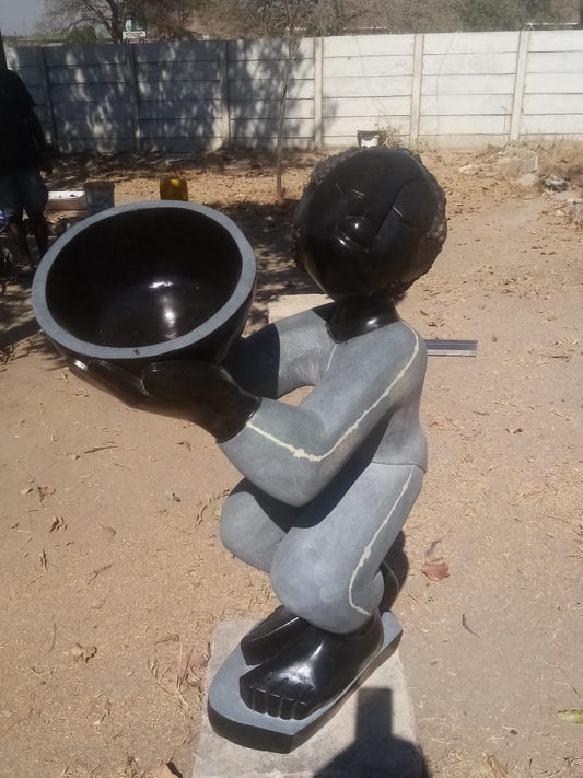 At Your Service - Stone Sculpture Made of Springstone by Jetro Zinyeka | Zimbabwe