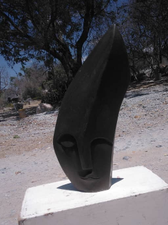 Stolen Glance - Stone Sculpture Made of Golden Serpentine by Clephas Zvirevo | Zimbabwe