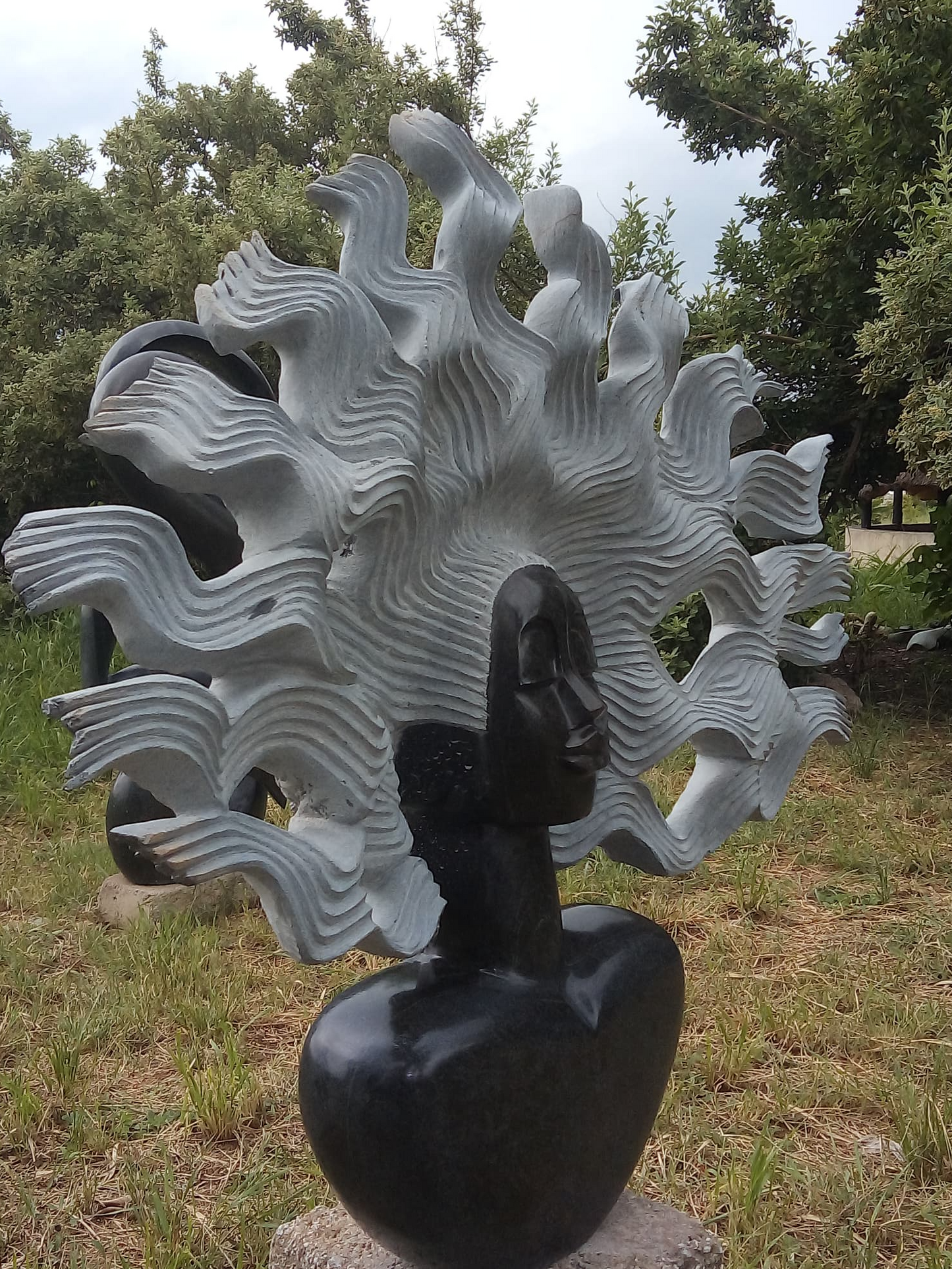 Blown Away - Stone Sculpture Made of Springstone by Godfrey Matangira | Zimbabwe