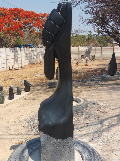 Grip of Hope - Stone Sculpture Made of Springstone by Patrick Fredy | Zimbabwe