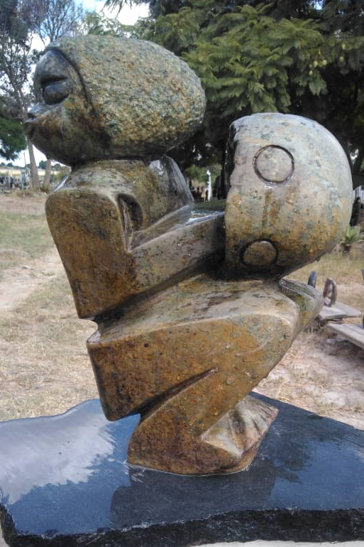 Mbira Player - Stone Sculpture Made of Spotted Opal Stone by Shingirai Madzongwe | Zimbabwe