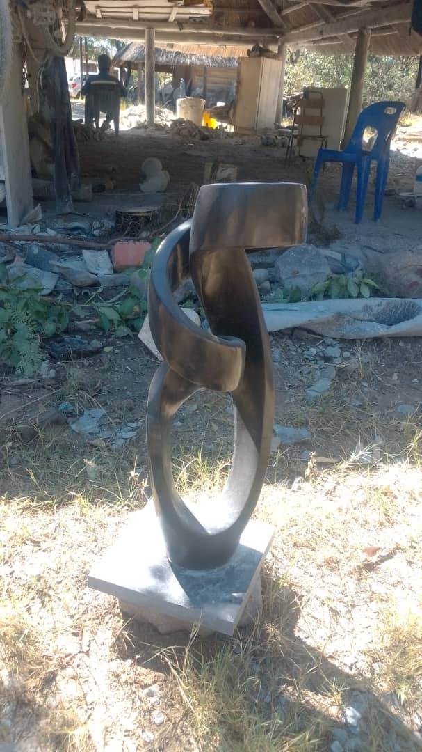 Model(Abstract) - Stone Sculpture Made of Springstone by Marshall Mangwere | Zimbabwe