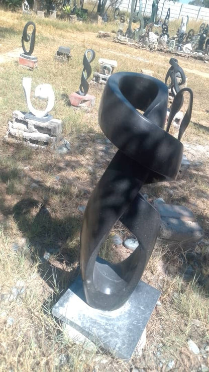 Model(Abstract) - Stone Sculpture Made of Springstone by Marshall Mangwere | Zimbabwe