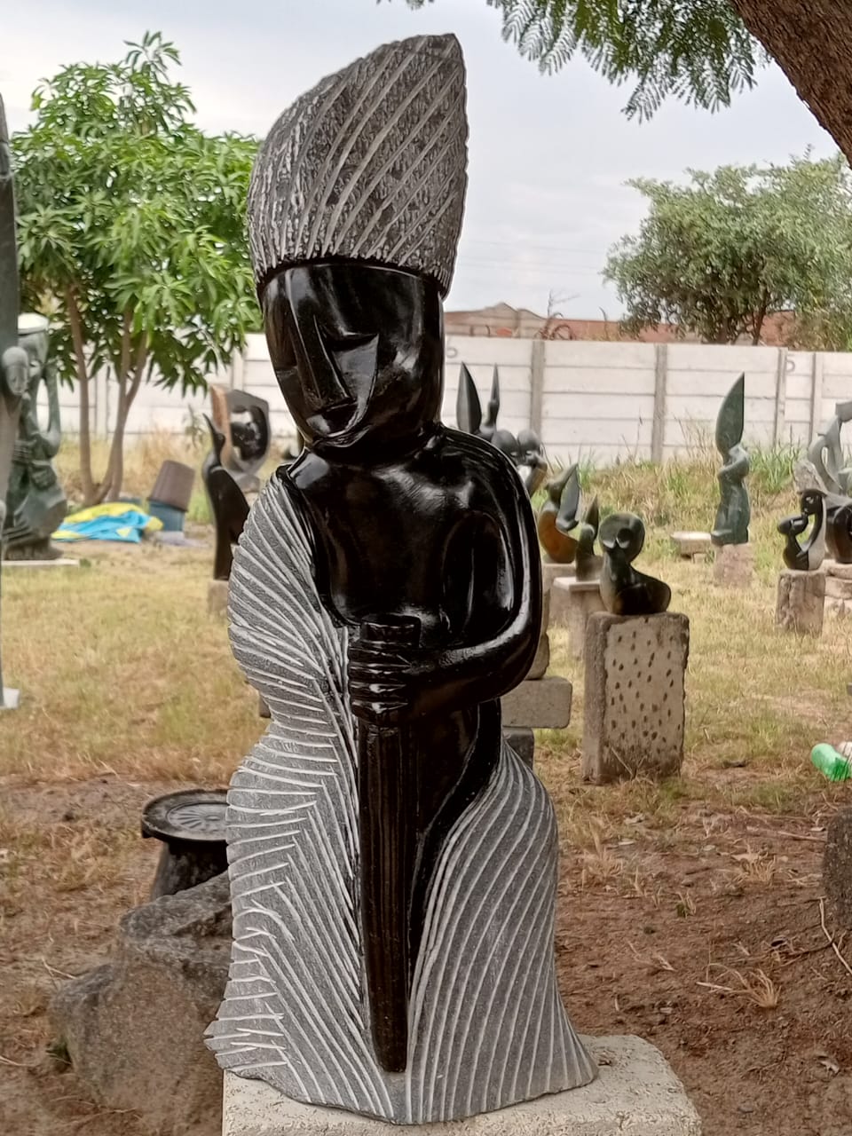 Granny - Stone Sculpture Made of Springstone by Nickson Muti | Zimbabwe