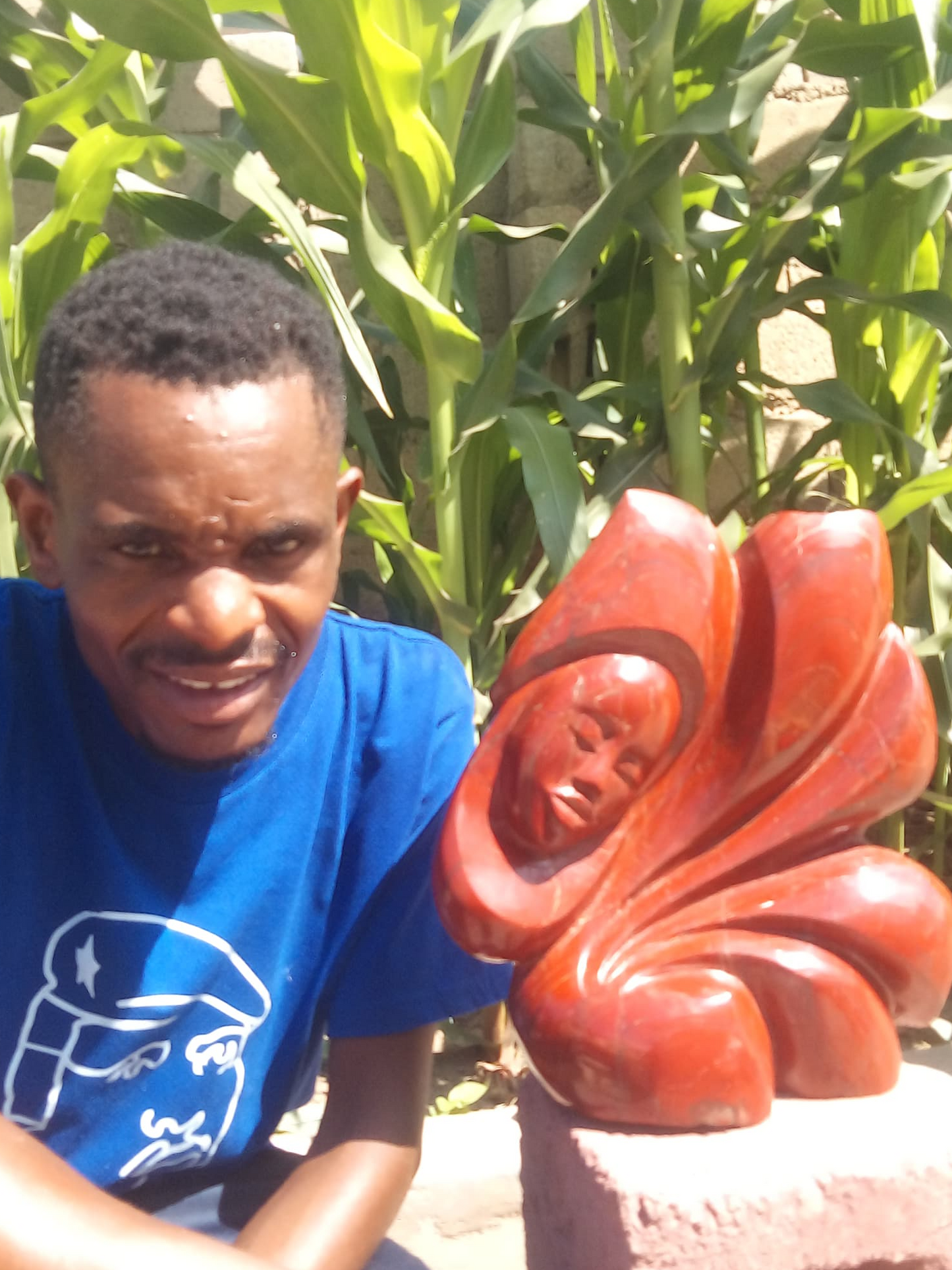 Not a Care - Stone Sculpture Made of Red Jasper by Batsirai Tago | Zimbabwe