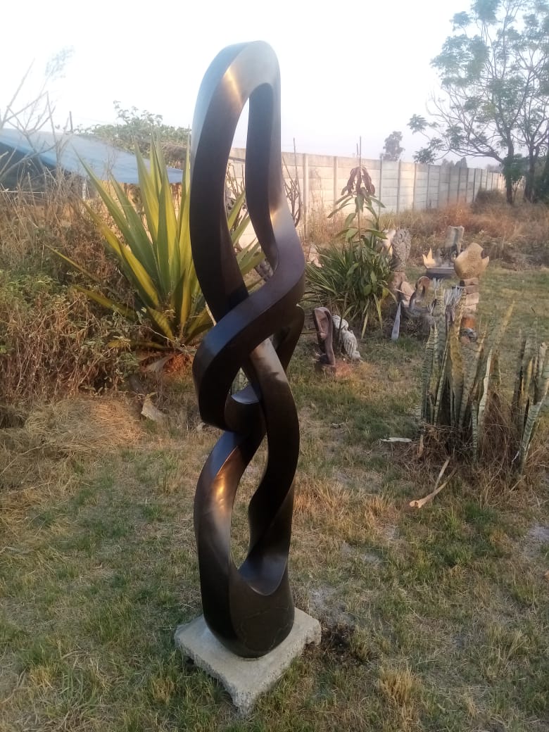 Silent Strength - Stone Sculpture Made of Springstone by Blessng Mutukwa | Zimbabwe