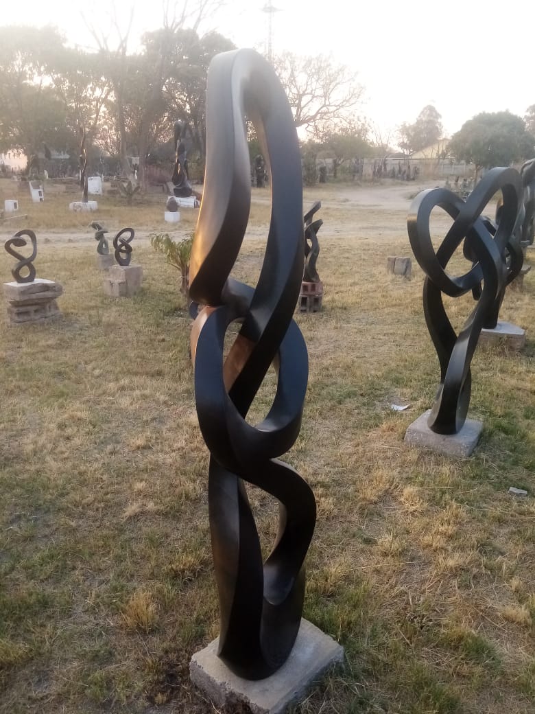 Silent Strength - Stone Sculpture Made of Springstone by Blessng Mutukwa | Zimbabwe