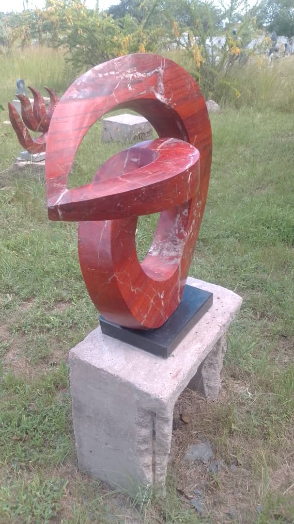 Slip Away - Stone Sculpture Made of Red Jasper by Gift Mutsahuni | Zimbabwe