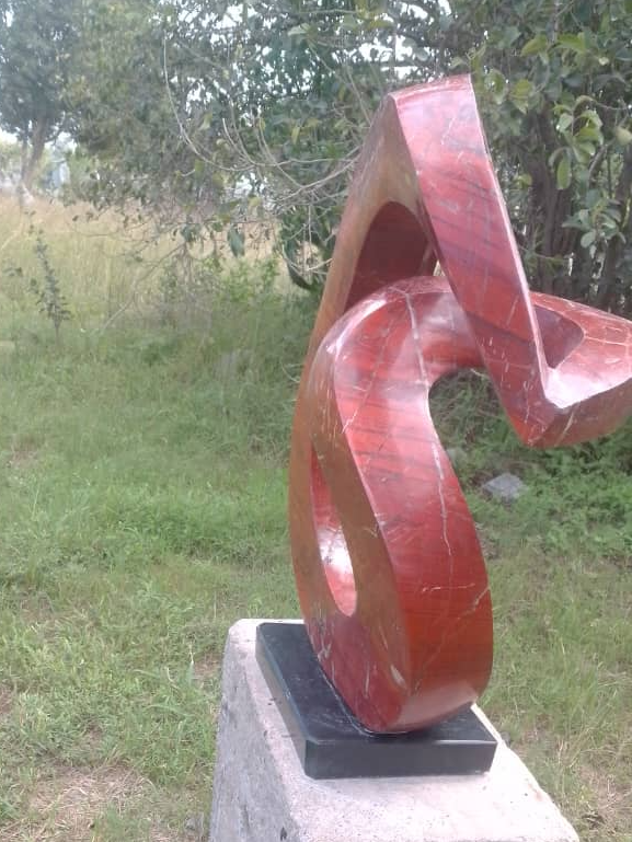 Slip Away - Stone Sculpture Made of Red Jasper by Gift Mutsahuni | Zimbabwe