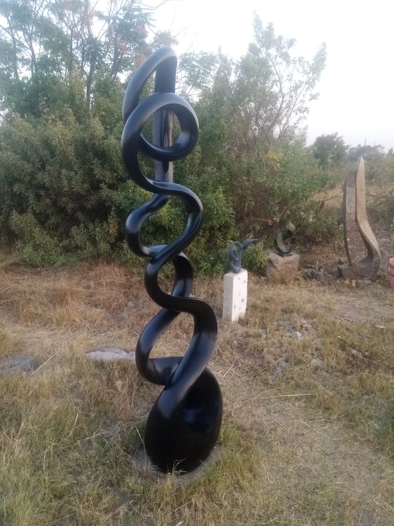 Whispers of the Past - Stone Sculpture Made of Springstone by Livingstone Matambo | Zimbabwe