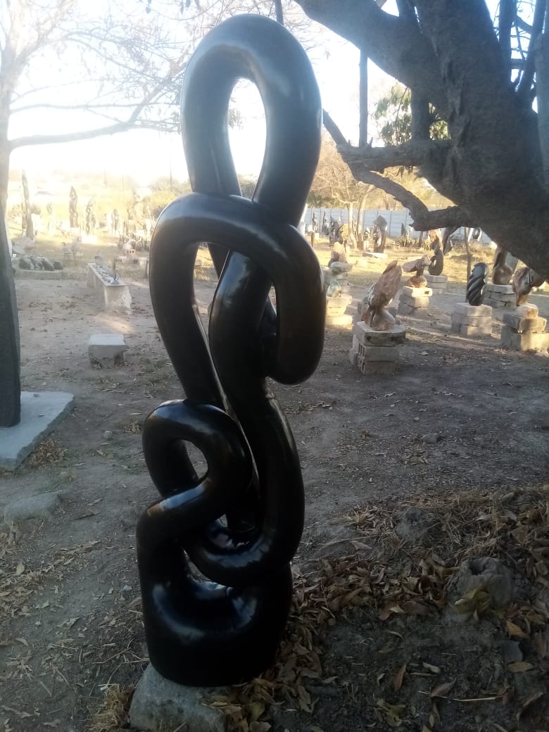 Reminiscing - Stone Sculpture Made of Springstone by Takavira Taruvinga | Zimbabwe