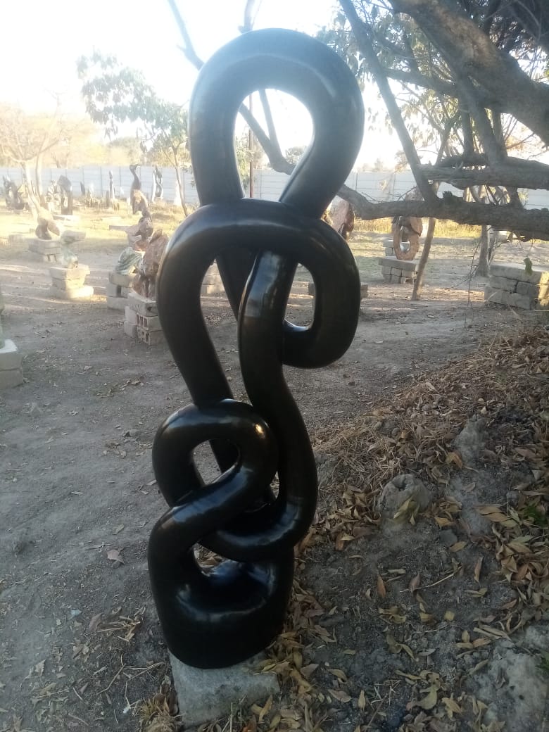 Reminiscing - Stone Sculpture Made of Springstone by Takavira Taruvinga | Zimbabwe
