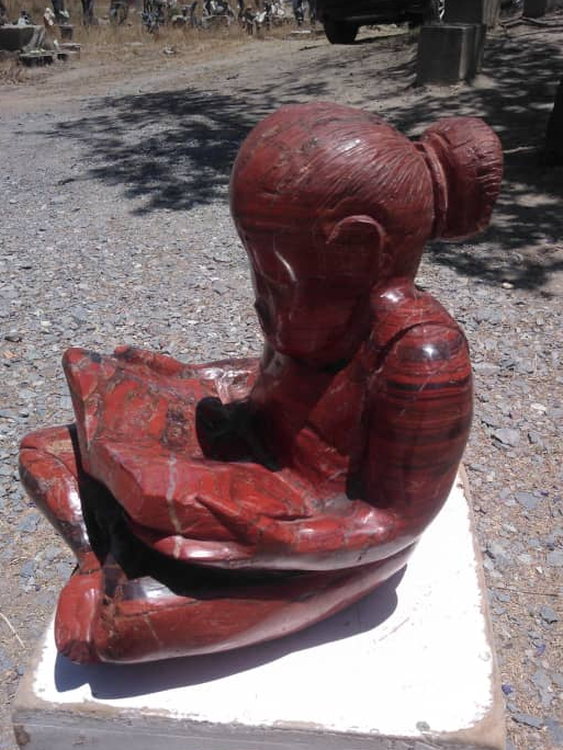 Study Time - Stone Sculpture Made of Red Jasper by Jonathan Mhondorohuma | Zimbabwe