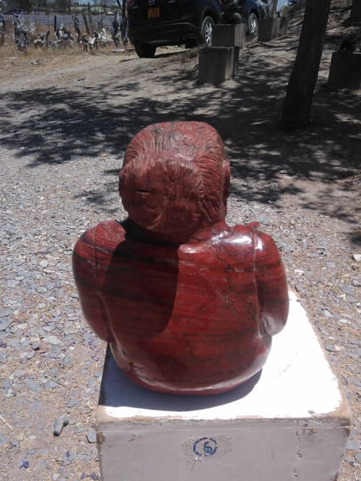 Study Time - Stone Sculpture Made of Red Jasper by Jonathan Mhondorohuma | Zimbabwe