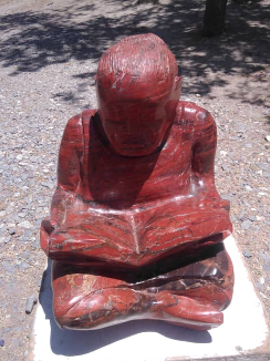 Study Time - Stone Sculpture Made of Red Jasper by Jonathan Mhondorohuma | Zimbabwe