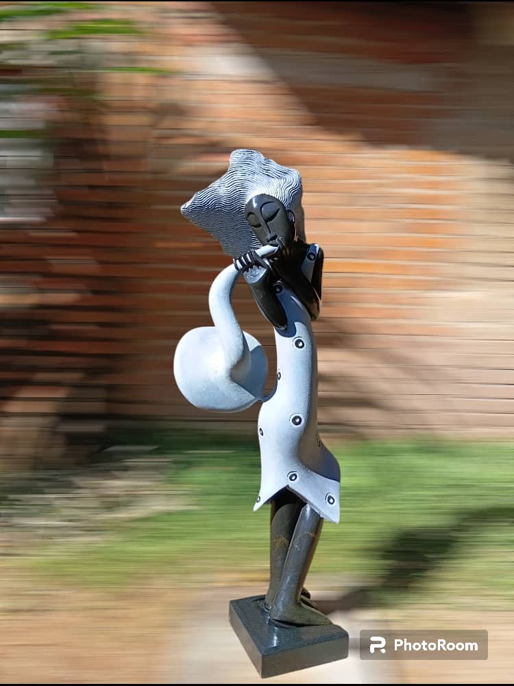 The Saxophonist - Stone Sculpture Made of Springstone by Tawanda Mashaya | Zimbabwe