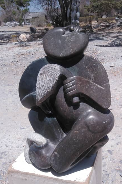 Traditional Man - Stone Sculpture Made of Fruit Stone by Lazarus Gobvu | Zimbabwe