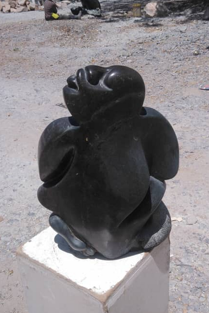 Traditional Man - Stone Sculpture Made of Fruit Stone by Lazarus Gobvu | Zimbabwe