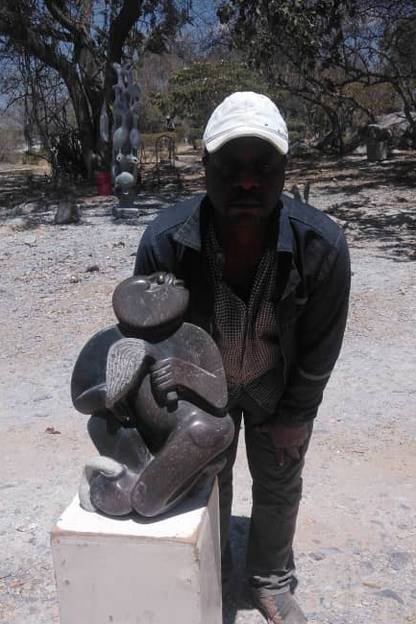 Traditional Man - Stone Sculpture Made of Fruit Stone by Lazarus Gobvu | Zimbabwe