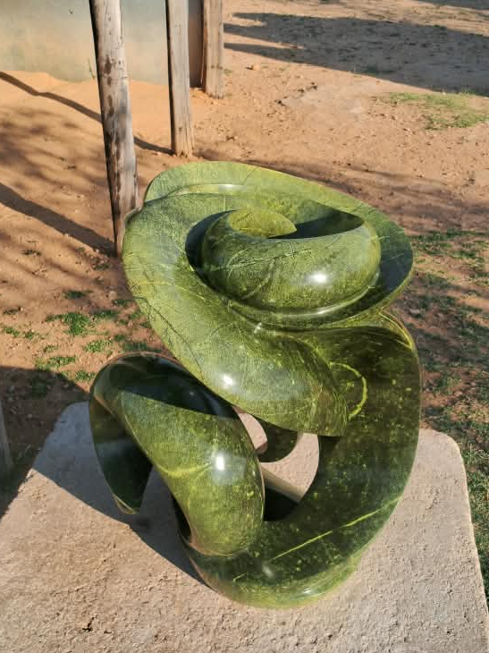 Verdant Unfurling - Abstract Stone Sculpture Made of Avocado Stone by James Phiri | Zimbabwe