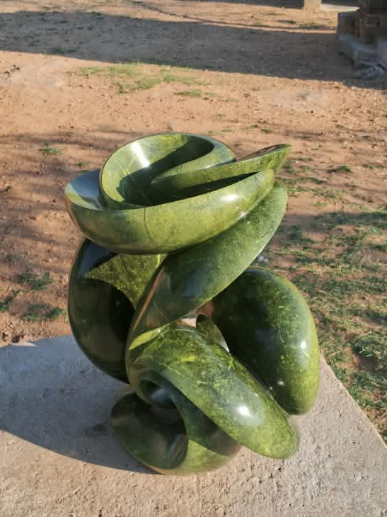 Verdant Unfurling - Abstract Stone Sculpture Made of Avocado Stone by James Phiri | Zimbabwe