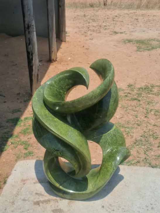 Blooming Flower - Stone Sculpture Made of Avocado Stone by James Phiri | Zimbabwe