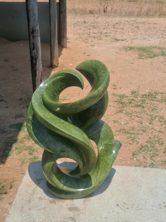 Blooming Flower - Stone Sculpture Made of Avocado Stone by James Phiri | Zimbabwe