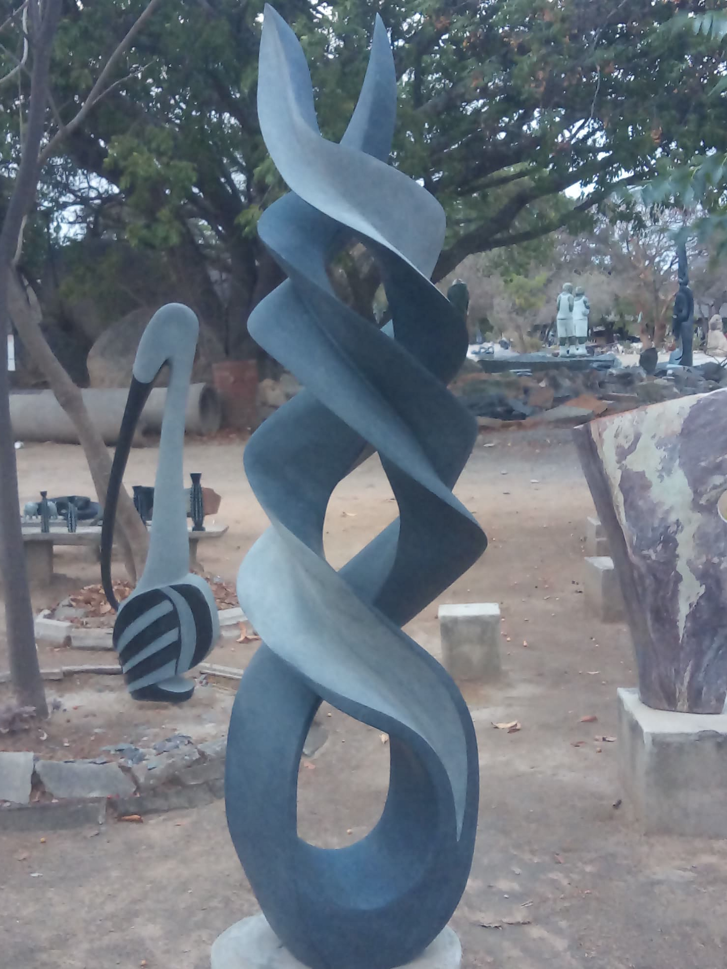 Reaching For The Sun - Stone Sculpture Made of Springstone by Onias Mupumha | Zimbabwe